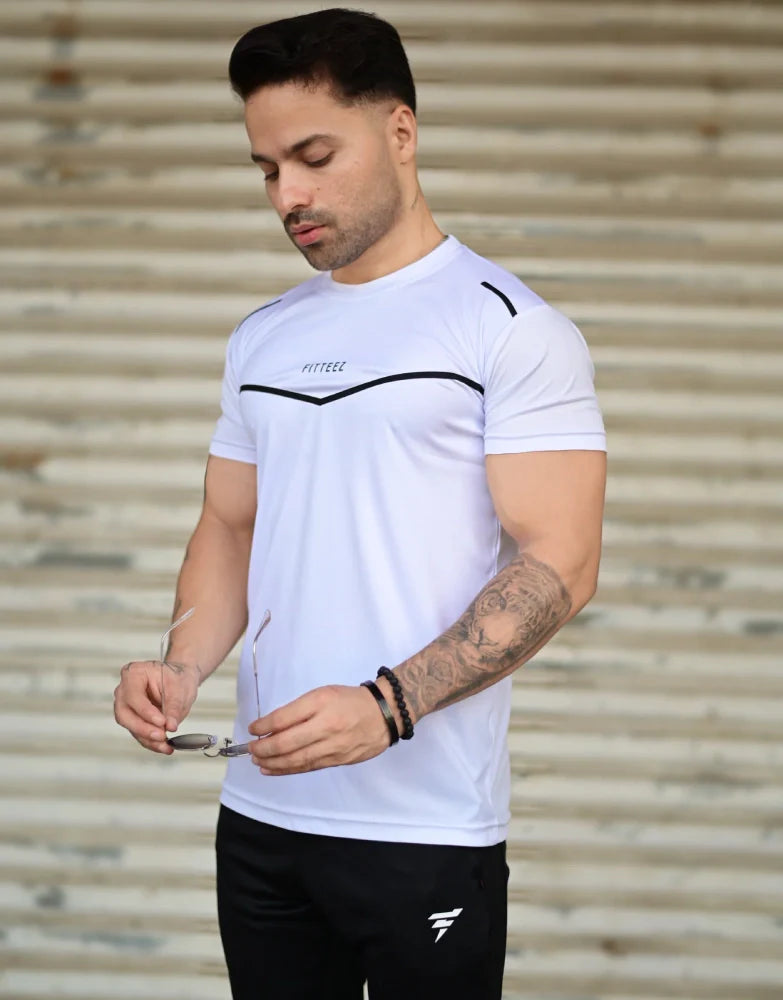 Male model wearing a two-tone white and black track suit with a bold modern design - Royal Outfits