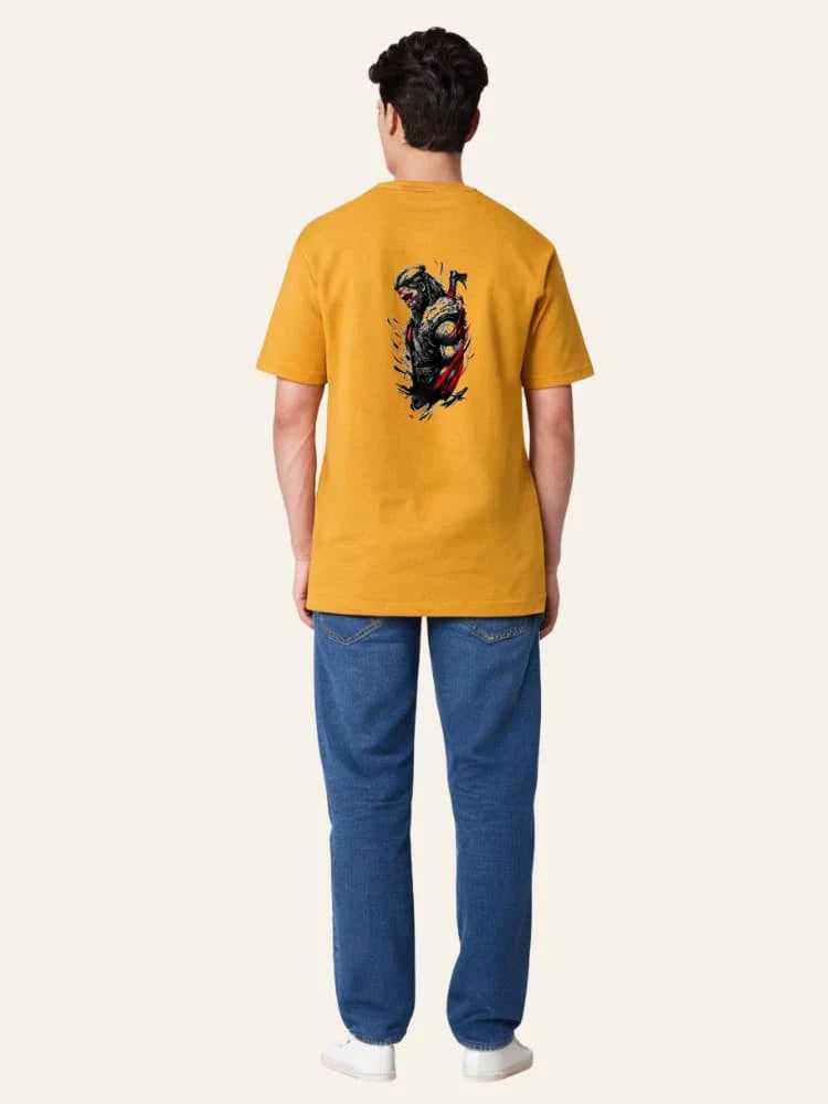 Person wearing a mustard yellow t-shirt with a graphic design on the back, standing against a white background.