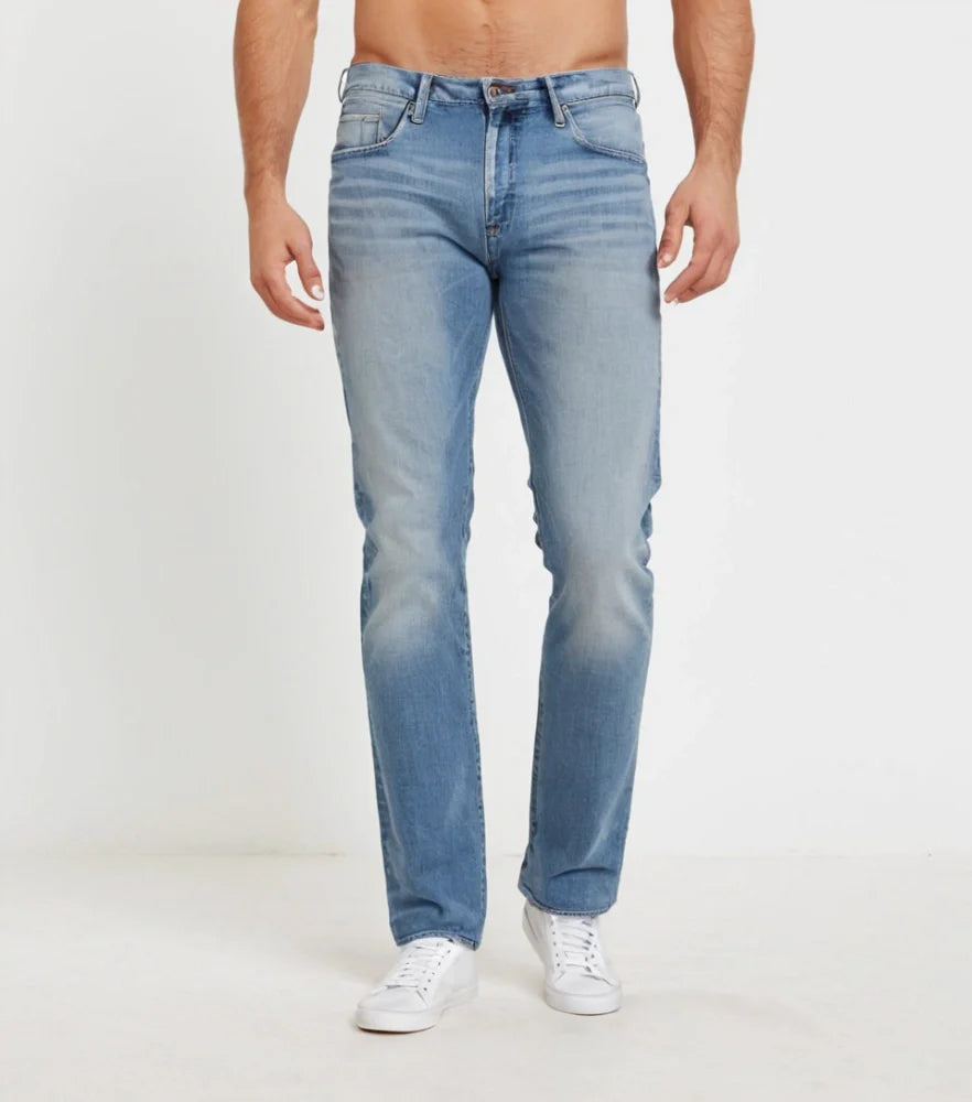Front-facing image of faded straight-cut denim jeans styled casually on a male model - Royal Outfits
