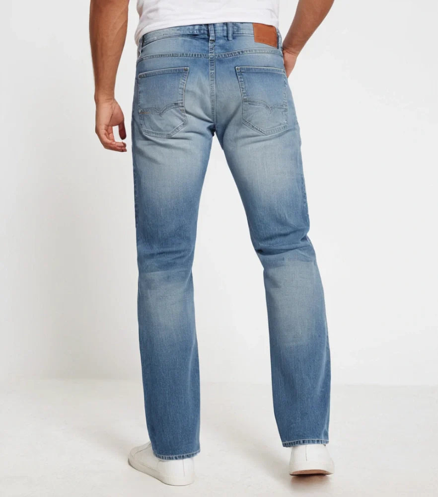 Front-facing image of faded straight-cut denim jeans styled casually on a male model - Royal Outfits