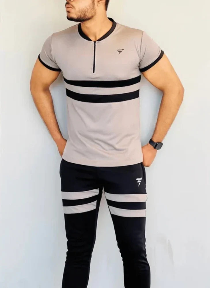 Model dressed in a beige full-sleeve track suit with a front zip and matching joggers - Royal Outfits