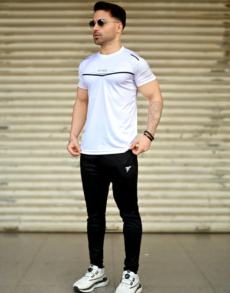 Male model wearing a two-tone white and black track suit with a bold modern design - Royal Outfits