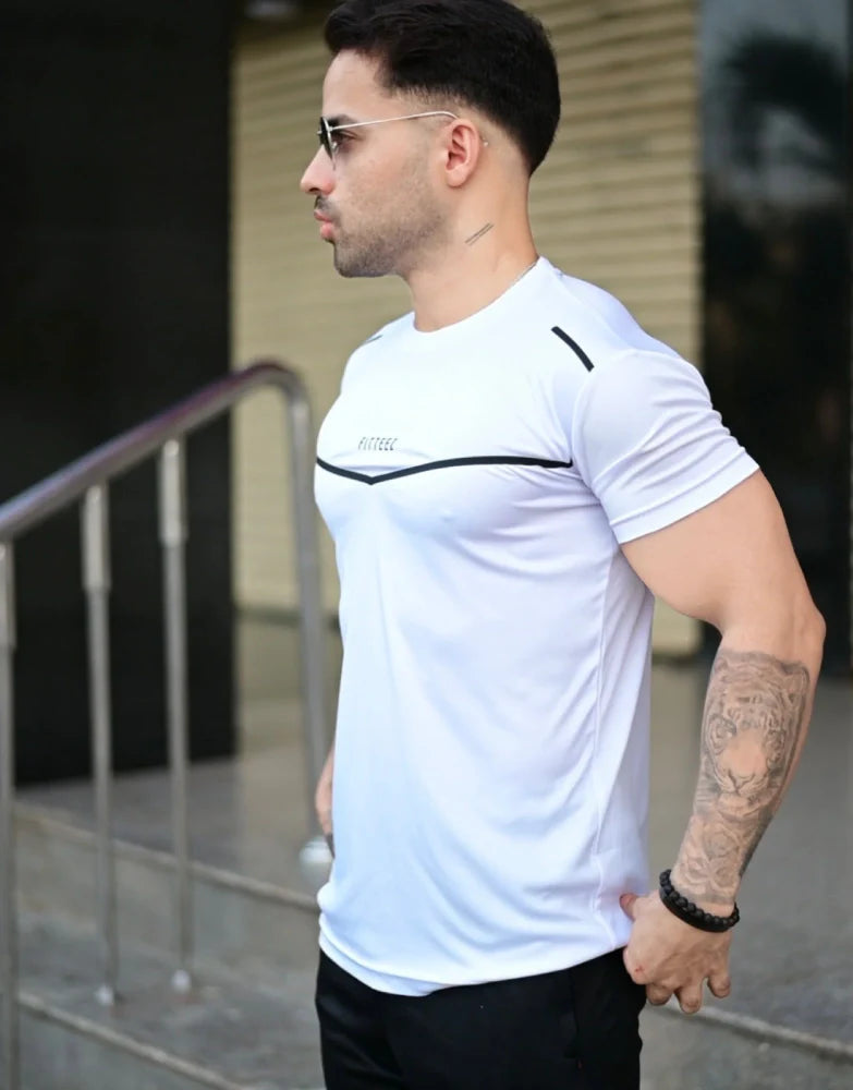 Male model wearing a two-tone white and black track suit with a bold modern design - Royal Outfits