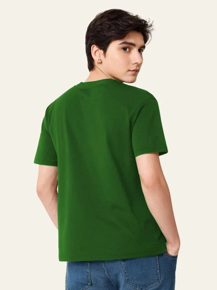 Person wearing a green t-shirt on a plain background