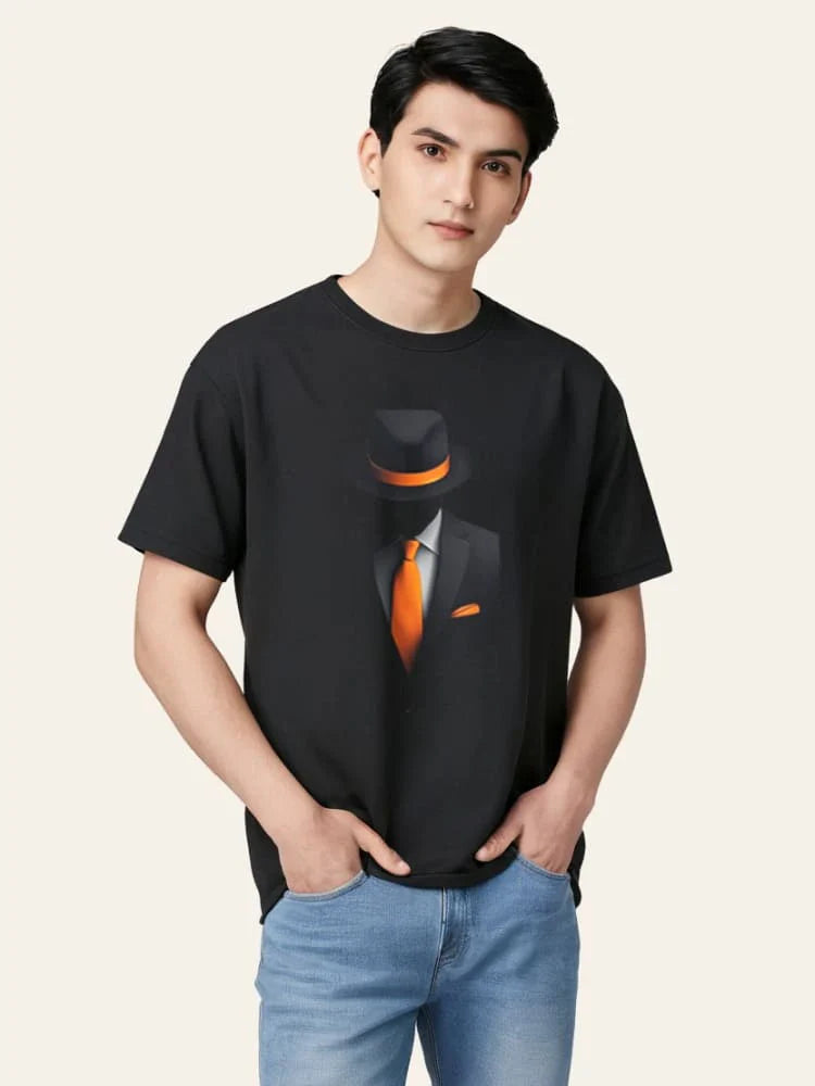 Person wearing a black t-shirt with a graphic design on a plain background
