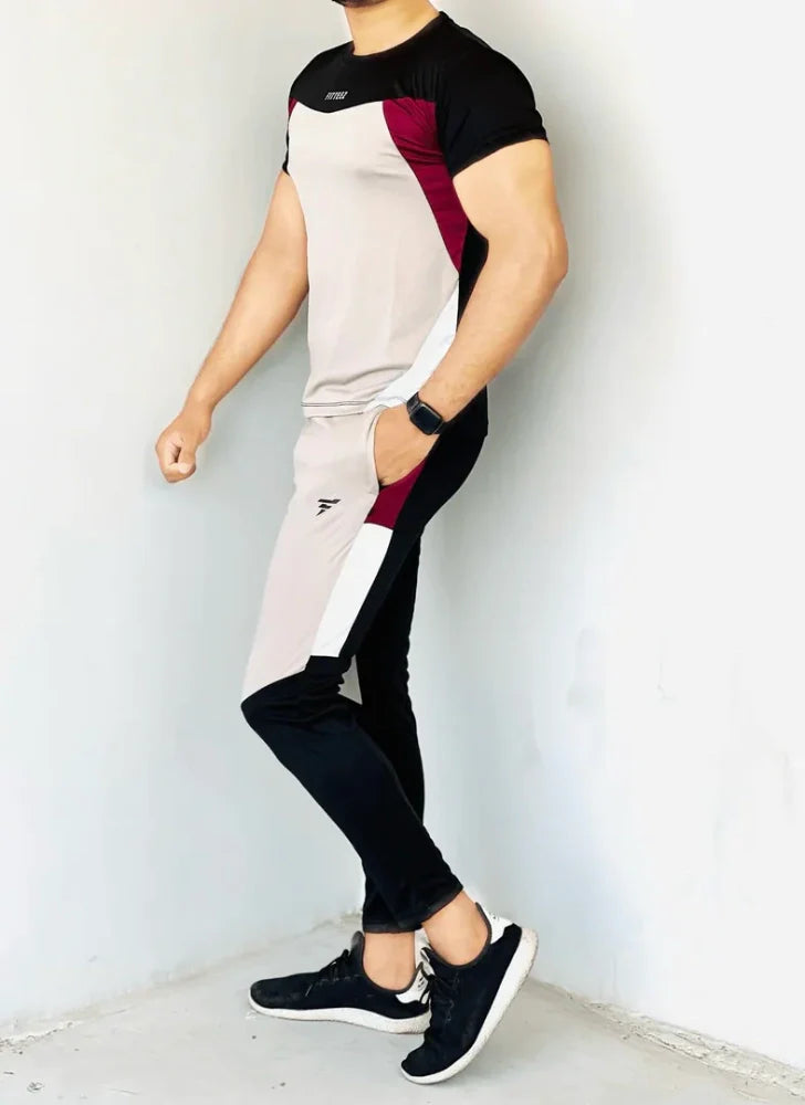 Gray Diamond-patterned track suit featuring a fitted jacket and tapered pants, styled on a male model - Royal Outfits
