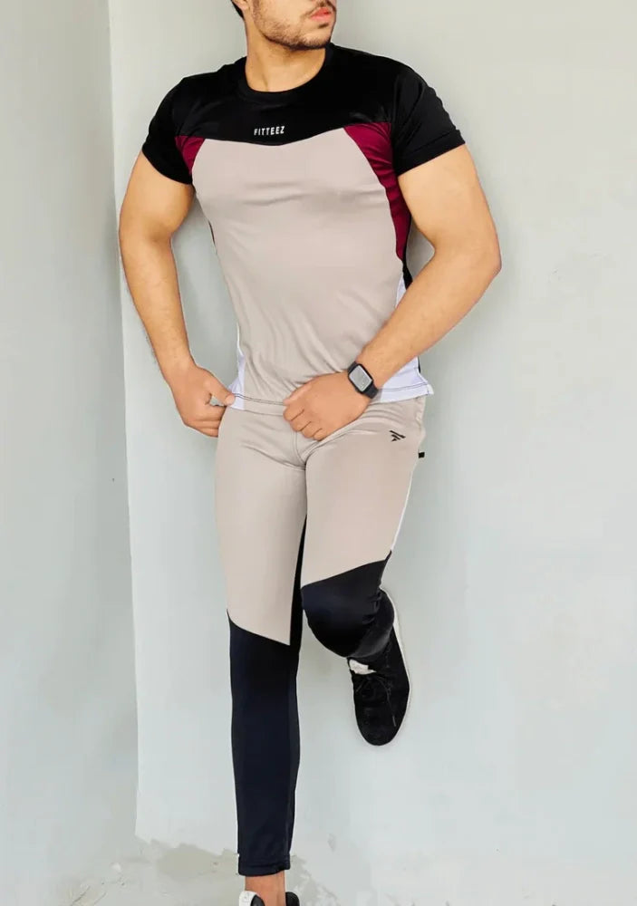 Gray Diamond-patterned track suit featuring a fitted jacket and tapered pants, styled on a male model - Royal Outfits