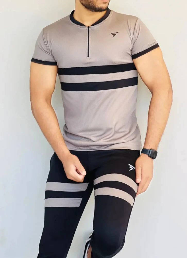 Model dressed in a beige full-sleeve track suit with a front zip and matching joggers - Royal Outfits