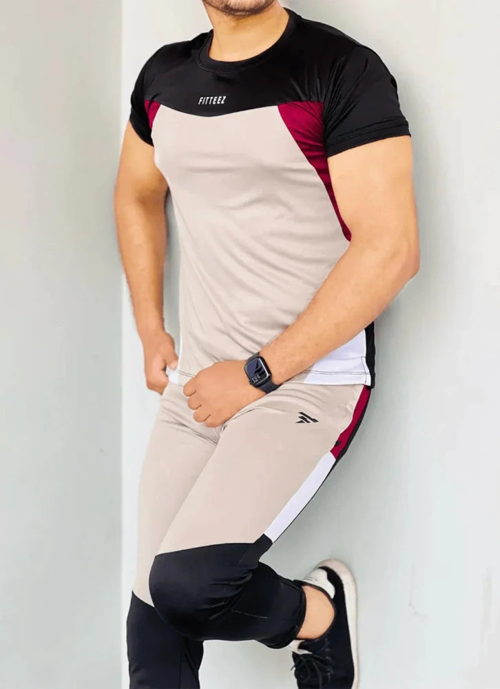 Gray Diamond-patterned track suit featuring a fitted jacket and tapered pants, styled on a male model - Royal Outfits