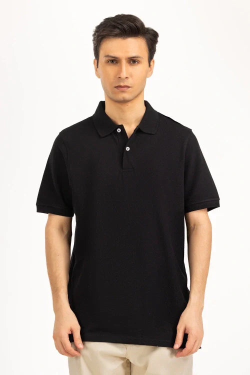 Man wearing a black polo shirt on a white background