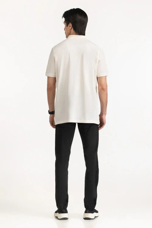 Person wearing a white polo shirt and black pants on a white background White Regular Fit Men POLO T-Shirt Royal Outfits
