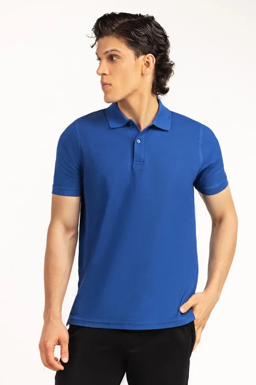 Man wearing a blue polo shirt on a white background