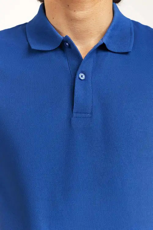 Close-up of a blue polo shirt with a collar