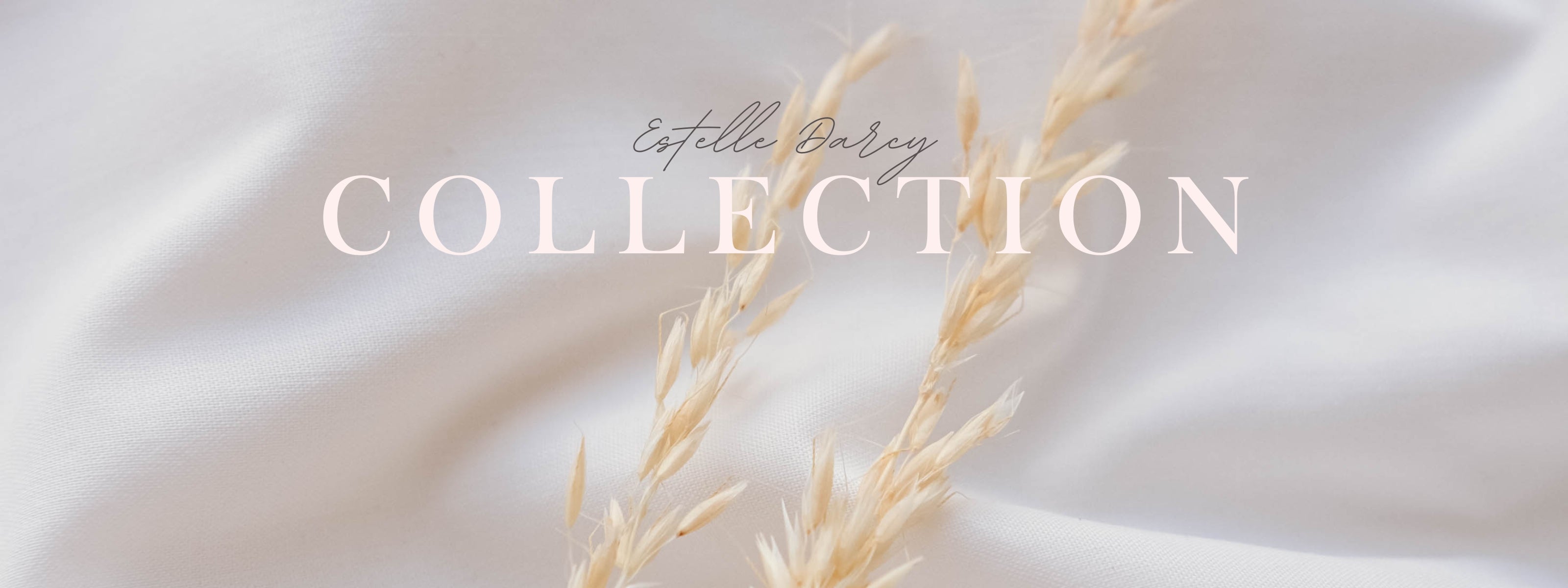 Text 'Estelle Baley Collection' on a soft beige background with a delicate plant stem.